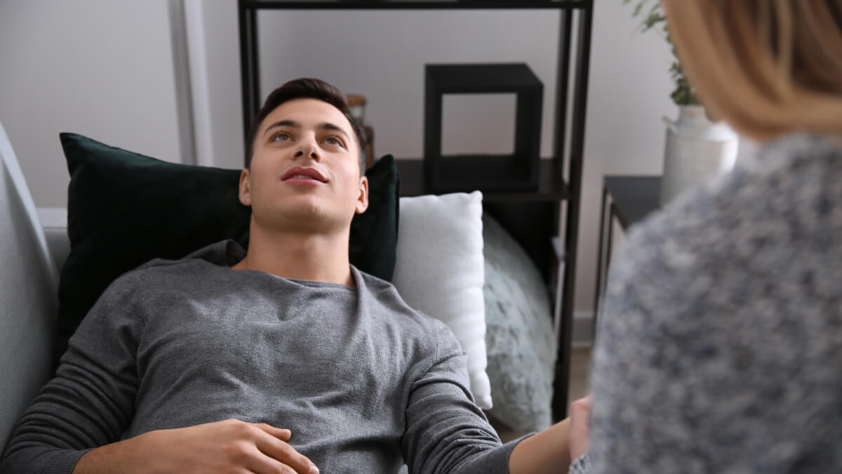 Man lying with therapist