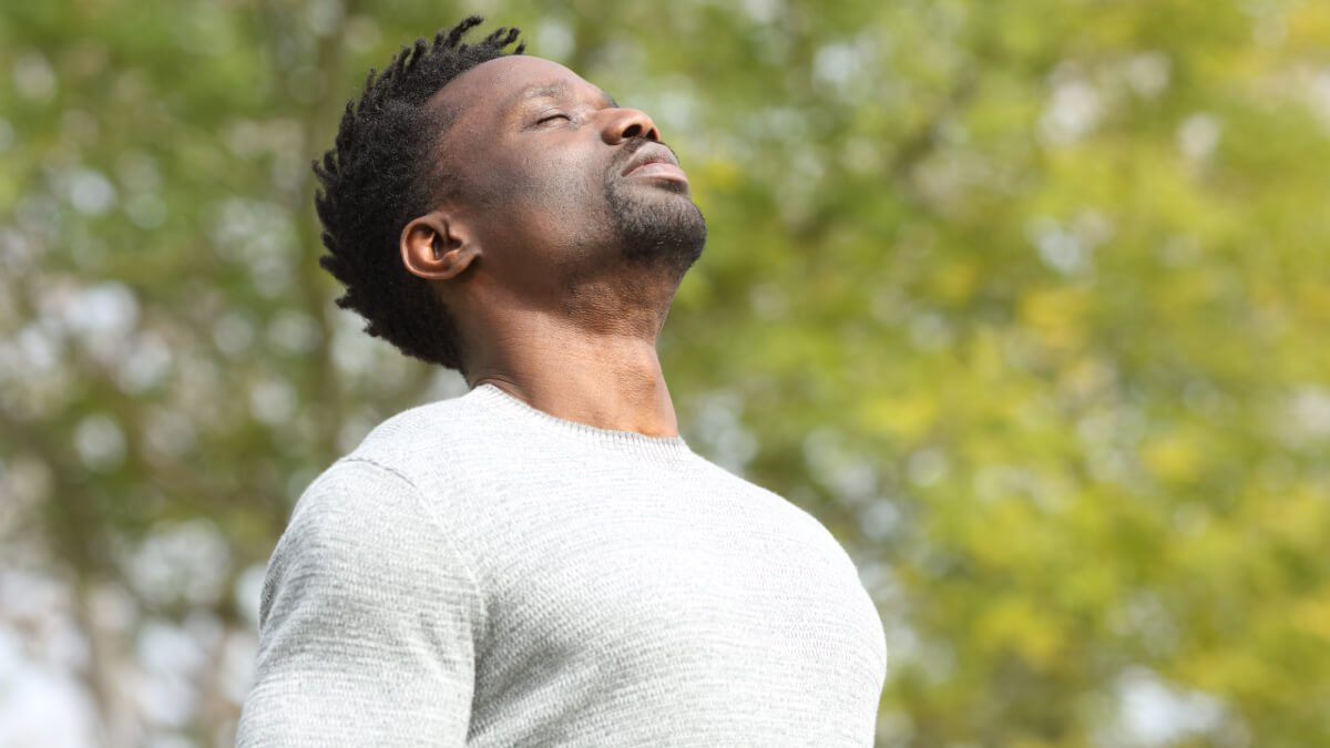 Man taking deep breath