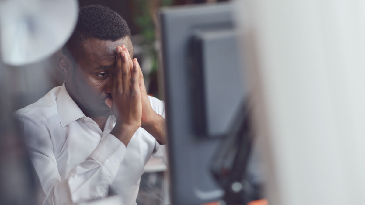 Man stressed at computer